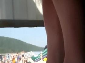 Sun burnt ass spied in a beach cabin