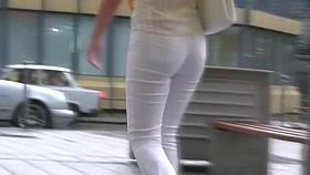 Beauty in tight white pants stars in a candid street video