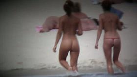 Naked hot babes enjoying a sunny day at the beach