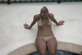Big hips blonde in nude style bikini at the pool