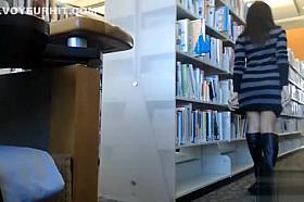 Female student makes upskirt selfie in library