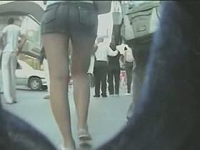 Voeyur cam slowly closing in on a girl walking down the street